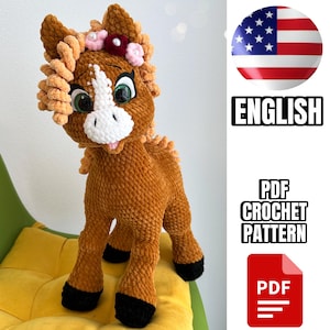 May include: Crochet pattern for a brown and white horse amigurumi toy with a pink flower headband. The pattern is available in PDF format and is written in English.