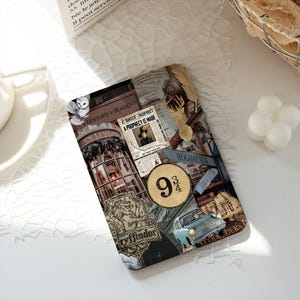May include: A rectangular e-reader cover featuring a collage of magical imagery including a Daily Prophet newspaper clipping with the text A PROPHECY IS MADE, a 9 3/4 sign, a Gryffindor crest, a light blue car, a white owl, and a golden stag silhouette.