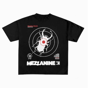 May include: A black short-sleeve t-shirt featuring a white graphic of a beetle inside a target. Text includes Massive Attack, D20M4Y1998, a list of song titles, and the word MEZZANINE in large white letters with a small beetle icon.