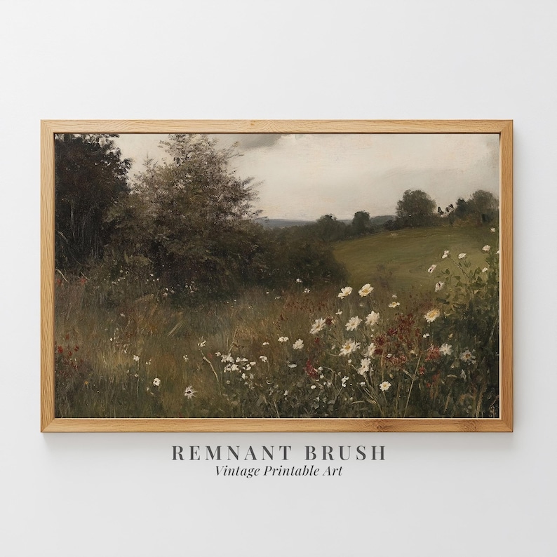 May include: A vintage landscape painting in a light wood frame. The artwork depicts a field of wildflowers and tall grass, with trees and a cloudy sky in the background. The text "REMANT BRUSH Vintage Printable Art" is at the bottom.