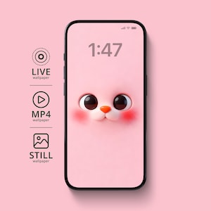 May include: A smartphone displays a pink animated wallpaper featuring a cartoon cat face with large, dark eyes, rosy cheeks, and a small orange nose. The time 1:47 is shown at the top. Icons for live, MP4, and still wallpapers are on the left.