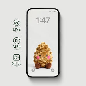 May include: A smartphone displays a cute, plush pinecone character with rosy cheeks and a smiling face. The screen shows the time as 1:47. The phone's side shows options for live, MP4, and still wallpapers.