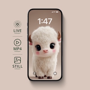 May include: A smartphone displays a cute cartoon yak wallpaper. The yak has fluffy white fur, large black eyes, and small brown horns. The time 1:47 is displayed at the top. The phone is surrounded by icons for live, MP4, and still wallpapers.
