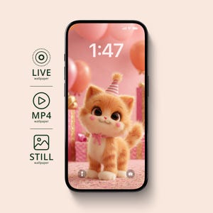 May include: A smartphone displays a cute cartoon kitten wearing a party hat, with a pink bow, and rosy cheeks. The screen shows a pink background with balloons and gift boxes. The time 1:47 is displayed at the top. The phone is black.