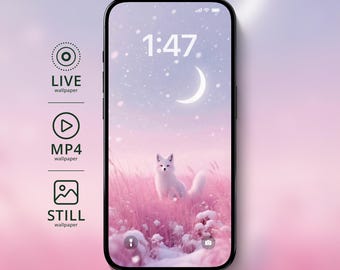 以下が含まれることがあります： スマートフォンは、三日月の下のピンク色のフィールドに白いキツネがいる冬のシーンの壁紙を表示します。時刻1:47が表示されます。アイコンは、ライブ、MP4、静止壁紙オプションを示しています。