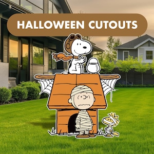 May include: A set of Halloween cutouts featuring Snoopy as a pilot on a doghouse, Charlie Brown wrapped in bandages like a mummy, and Woodstock also wrapped in bandages. The text HALLOWEEN CUTOUTS is displayed in a brown banner at the top.