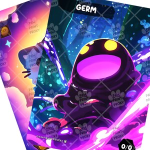May include: Two fantasy art cards. One card features a creature with a purple body and yellow eyes, with the word "GERM" at the top. The other card has a cat-like figure with a colorful background. Both cards have a 0/0 symbol.
