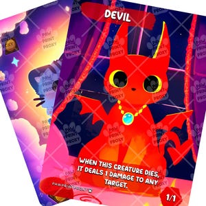 May include: Two fantasy trading cards. One card features a red devil character with the word "DEVIL" at the top. The other card has a cat-like character. The devil card has text that reads "WHEN THIS CREATURE DIES, IT DEALS 1 DAMAGE TO ANY TARGET."