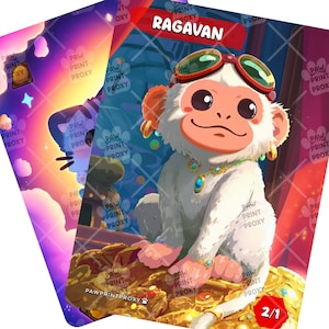 May include: Two fantasy art cards featuring a white monkey with sunglasses, jewelry, and the name "RAGAVAN". The cards have a colorful background with the text "PAW PRINT PROXY". One card shows a creature with a bottle.