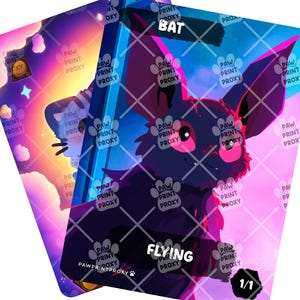 May include: Two trading cards with a bat illustration. The bat is black with pink accents and large ears. The cards have the words "BAT" and "FLYING" printed on them, along with "1/1". The background is a gradient of purple, pink, and blue.