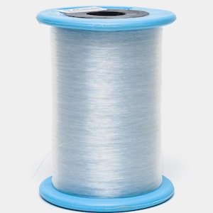 May include: A spool of clear, thin elastic cord wrapped around a cylindrical core with bright blue plastic end caps. The top cap features a white label with the text 0.40mm printed in black, indicating the diameter of the cord material.