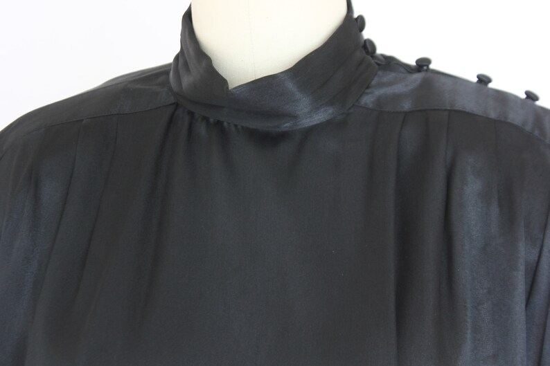 long sleeve blouse in satiny black size 10