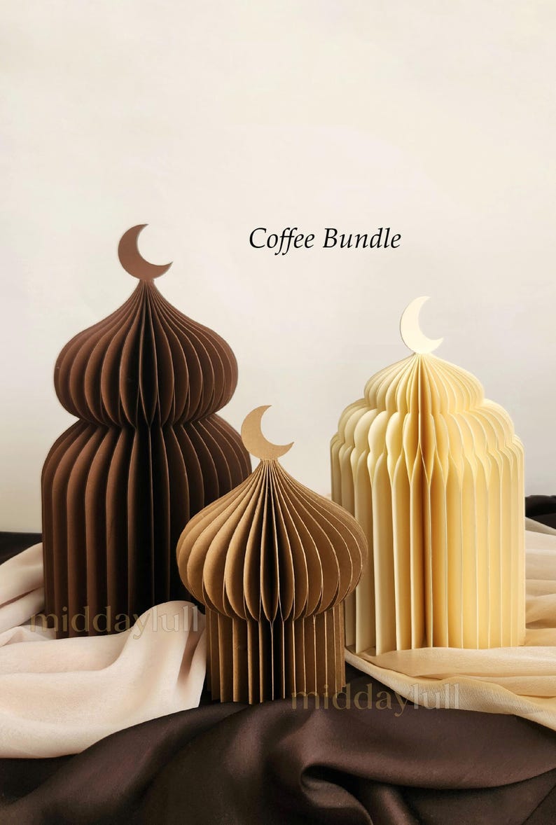May include: Three paper mosque-shaped decorations in varying sizes and colours: dark brown, light brown, and cream. Each has a crescent moon on top. The text "Coffee Bundle" is visible.
