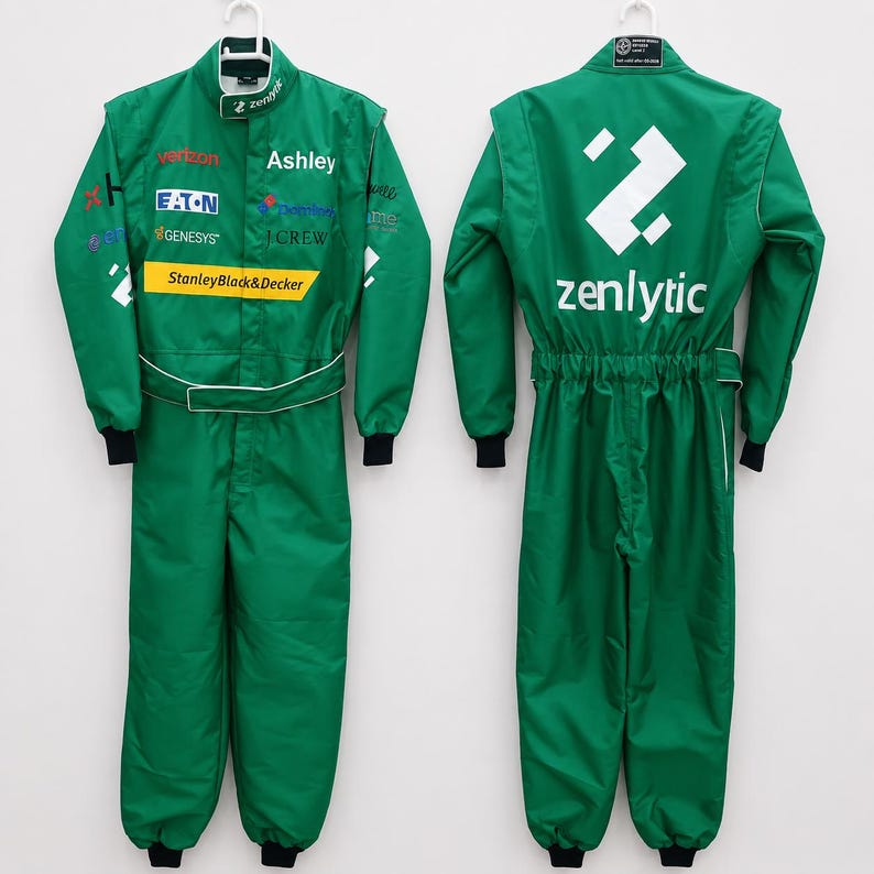 May include: A green racing jumpsuit shown from the front and back. The front features various sponsor logos including Verizon, Eaton, Genesys, and StanleyBlack&Decker. The back displays a large white geometric logo above the text zenlytic.