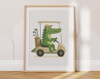 May include: A framed print featuring a cartoon alligator driving a golf cart. The alligator is green and wearing a brown cap. The golf cart is beige, and a golf bag with clubs is visible. The artwork is set against a white background.