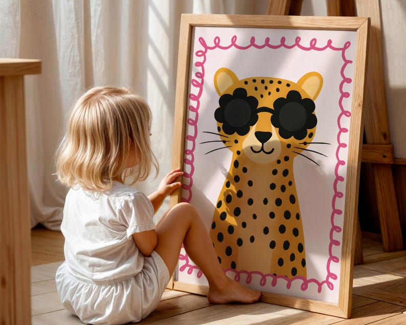 Cute cheetah wall art with flower sunglasses, toddler girl enjoying adorable leopard poster with pink border, perfect kids room decor, child-friendly animal art, interactive nursery wall print, engaging children's artwork, playful kids bedroom decoration, spotted cat illustration, fun animal poster kids, colorful nursery art, whimsical children's decor, wooden frame kids art, toddler room styling, child development wall art, educational animal print, happy kids room design, bright nursery poster