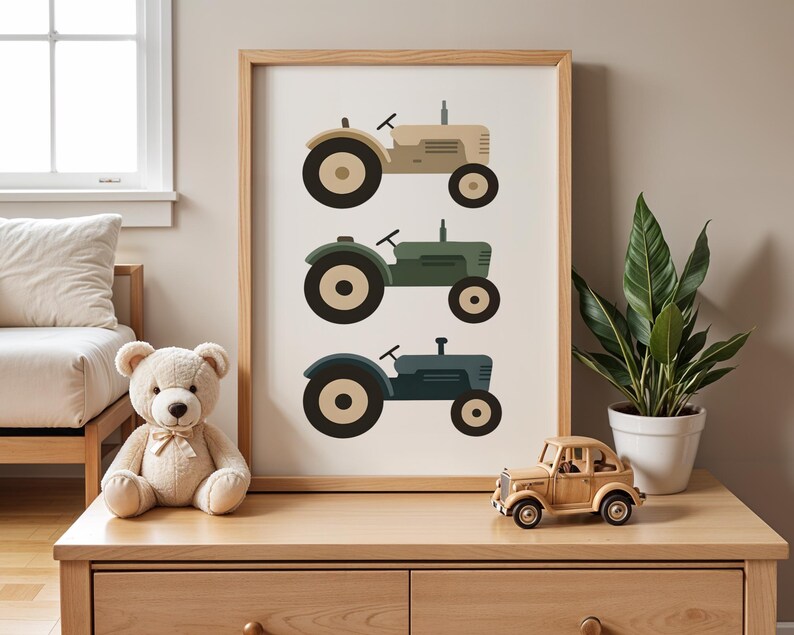 Vintage tractor nursery print on oak dresser with teddy bear wooden toy car and houseplant, farm themed toddler boy room decor styling, three tractors in muted beige olive blue tones, rustic farmhouse kids bedroom shelf decoration, natural wood furniture children's space aesthetic, minimalist vehicle artwork in light oak frame, curated playroom dresser top display ideas, neutral earth tone baby boy nursery inspiration, country style transportation wall art, modern scandinavian farm nursery.