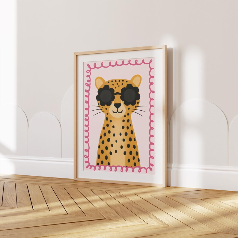 Cheetah nursery wall art print with trendy flower sunglasses - boho kids room decor featuring spotted leopard illustration with pink decorative border, perfect for modern baby girl nursery, toddler bedroom wall decor, safari themed playroom, animal lover children's art, Scandinavian style kids poster, minimalist nursery prints, contemporary child room decoration, wild cat artwork, jungle animal theme, stylish kids wall art, nursery gallery wall, baby shower present, unisex nursery decor.
