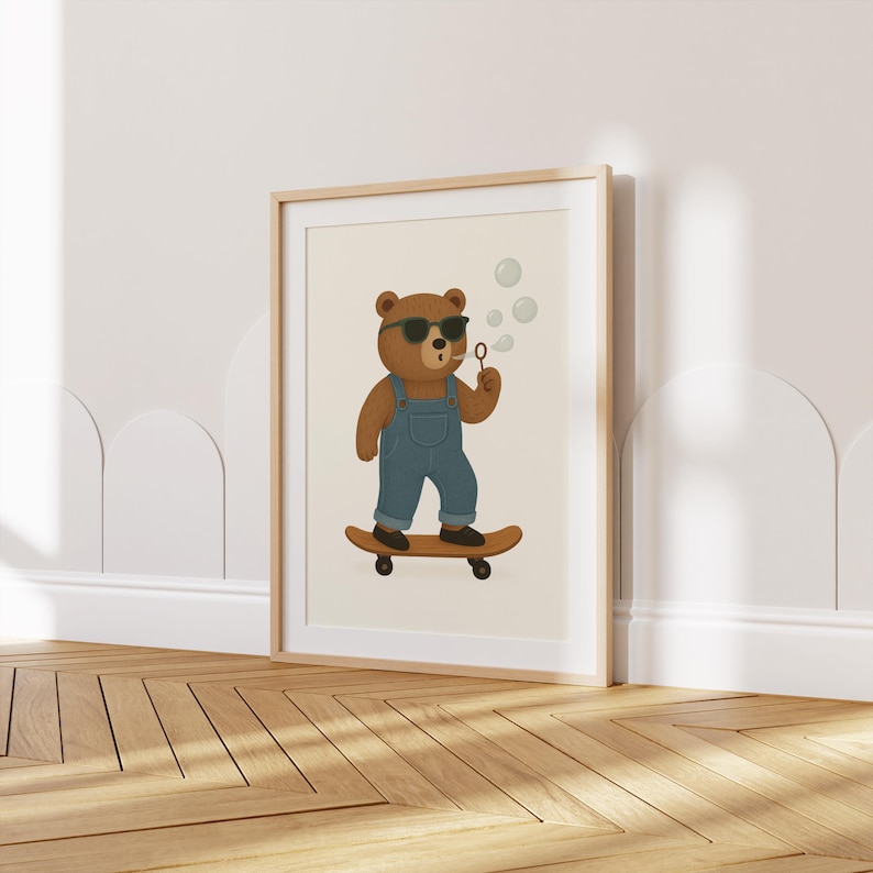 Digital nursery wall art printable featuring a cool bear wearing sunglasses and denim overalls, riding a skateboard and blowing bubbles. Perfect for toddler boy room decor, Scandinavian style kids room, or woodland animal nursery. This cute animal poster is ideal for gender-neutral nursery art, instant download digital print, and modern baby room decoration. Etsy kids wall decor for playful and stylish interiors.