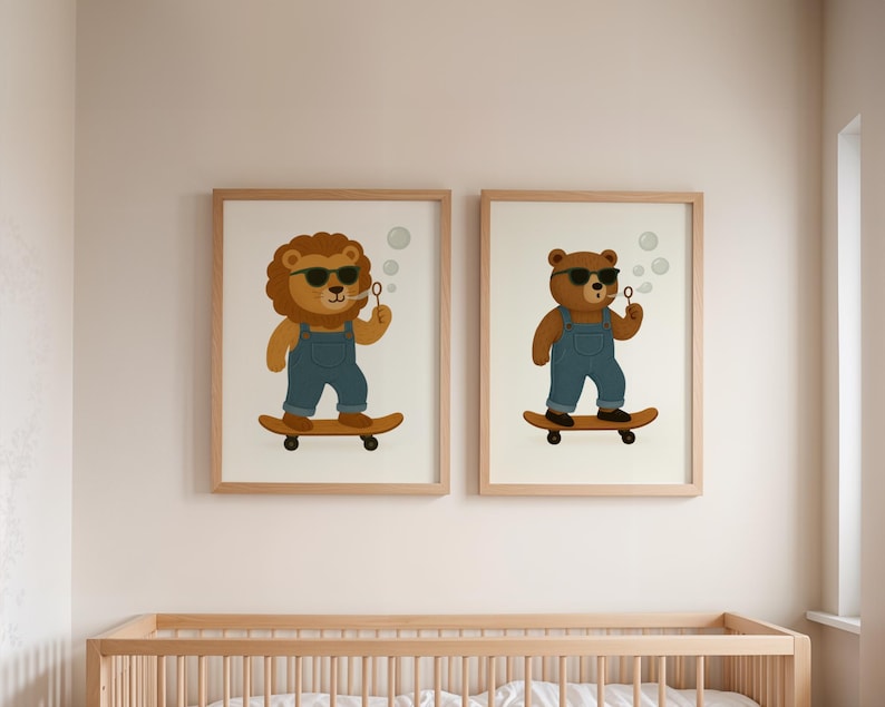 Set of two nursery wall art prints featuring skateboarding lion and bear with sunglasses and overalls – digital download animal posters above wooden crib – printable kids room decor in modern neutral style – twin animal illustrations with bubbles on skateboards – instant download gallery wall art for baby nursery or toddler bedroom – matching woodland animal poster set – lion and bear nursery prints for gender-neutral children's room styling.