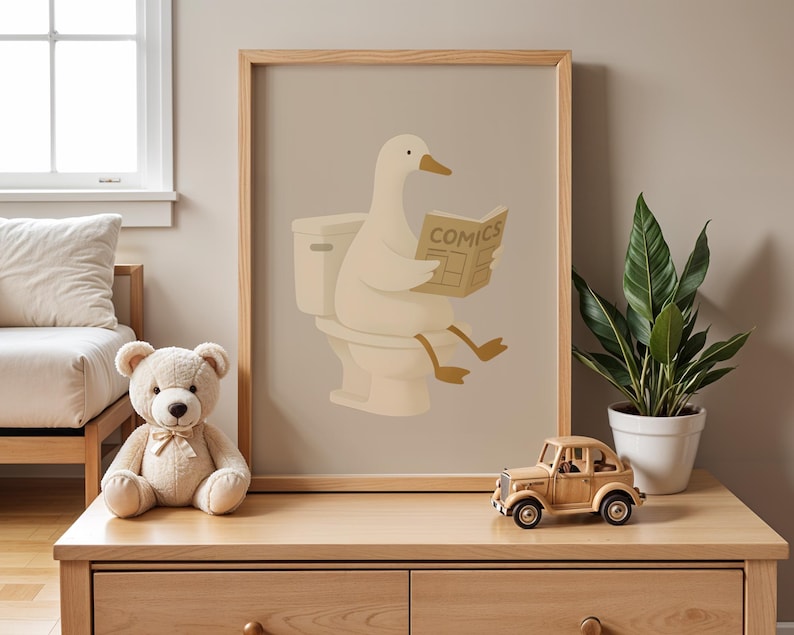 Funny duck bathroom art print, humorous animal wall decor poster, duck reading newspaper on toilet illustration, quirky bathroom wall art, cute duck comics print, minimalist bathroom humor decor, neutral beige bathroom poster, Scandinavian style wall art, modern farmhouse bathroom print, whimsical animal illustration, restroom wall hanging, powder room decor art, housewarming gift idea, unique bathroom sign, hygge home decor poster, natural wood frame art, playful duck artwork, guest bathroom.