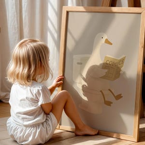 Interactive kids bathroom art print, toddler friendly wall decor, duck reading on toilet poster, playful potty training art, engaging children's bathroom print, educational animal illustration, fun bathroom sign for kids, encouraging toilet learning poster, cheerful nursery bathroom art, child height wall decor, Montessori inspired kids print, natural wood frame children's art, warm neutral toddler room poster, preschool bathroom wall hanging, gentle humor kids illustration.