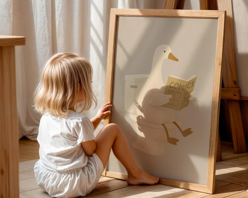 Interactive kids bathroom art print, toddler friendly wall decor, duck reading on toilet poster, playful potty training art, engaging children's bathroom print, educational animal illustration, fun bathroom sign for kids, encouraging toilet learning poster, cheerful nursery bathroom art, child height wall decor, Montessori inspired kids print, natural wood frame children's art, warm neutral toddler room poster, preschool bathroom wall hanging, gentle humor kids illustration.