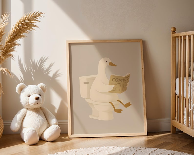 Funny duck bathroom art print for kids nursery, whimsical animal reading on toilet poster, nursery bathroom decor, children's room wall art, cute duck illustration for baby room, playful bathroom humor kids art, neutral beige nursery print, Scandinavian children's decor, minimalist kids bathroom poster, duck reading comics artwork, gender neutral nursery art, modern farmhouse kids room, soft neutral tones children's print, adorable animal bathroom sign, toddler bathroom wall decor.