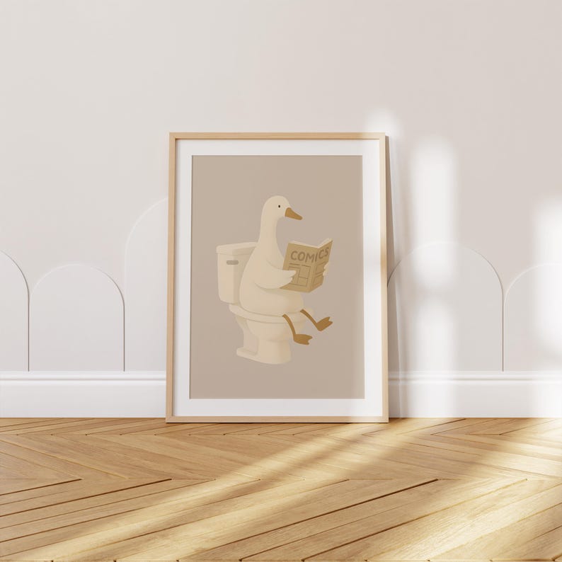 Minimalist duck illustration art print reading newspaper on toilet, funny bathroom wall decor, quirky animal poster, whimsical goose artwork, humorous restroom art, Scandinavian style bathroom print, neutral beige cream tones, modern farmhouse decor, cute duck bathroom sign, comical animal reading print, powder room wall art, guest bathroom decor, Nordic design poster, hygge home decor, light wood frame mockup, amusing waterfowl illustration, contemporary bathroom artwork, playful duck gift.