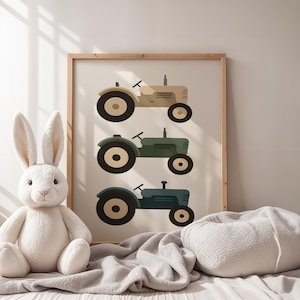 Vintage tractor nursery art print on cozy bed with plush white bunny and soft blanket, farm themed toddler boy bedroom decor, three tractors in muted beige green blue tones, rustic farmhouse kids room wall art in wooden frame, serene neutral baby boy nursery aesthetic, gentle morning light children's space, minimalist vehicle illustration for little farmers, calming earth tone playroom decoration, country style nursery poster, transportation themed artwork for tractor loving toddlers.