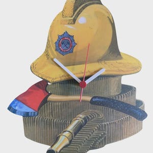 May include: A wall clock featuring a yellow firefighter helmet with a blue and red emblem, a red-headed axe, and a coiled fire hose with a brass nozzle. The clock face has two white hour and minute hands and a thin red second hand.