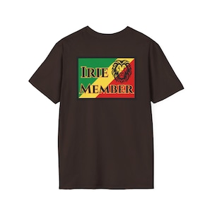 May include: A brown t-shirt featuring a rectangular graphic with the words "IRIE MEMBER" in green and yellow, and a lion's head in red and gold. The graphic is set against a background of green, yellow, and red, reminiscent of a flag.