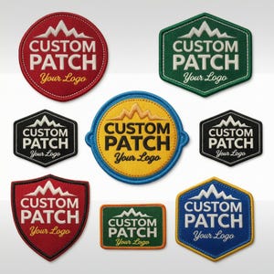 May include: A collection of eight embroidered patches in various shapes including circles, hexagons, and shields. Each patch features a mountain graphic above the text CUSTOM PATCH and the script text Your Logo in white, yellow, or black thread.