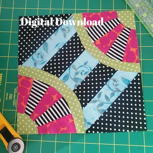 May include: A colorful patchwork quilt block with the text "Digital Download". The design features black polka dots, pink and orange fan shapes, and light blue floral patterns. The block is bordered with green polka dot fabric.