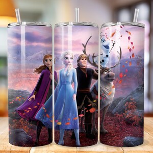 May include: Three stainless steel tumblers featuring a colourful image of characters from the film Frozen. The image shows Elsa, Anna, Kristoff, and Olaf standing in a snowy forest with a reindeer.