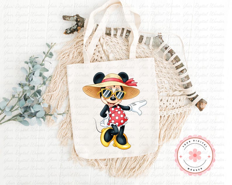 May include: A white tote bag featuring a cartoon Minnie Mouse character wearing sunglasses, a straw hat, and a red polka dot dress. The bag has cream-colored handles and a floral logo in the bottom right corner.