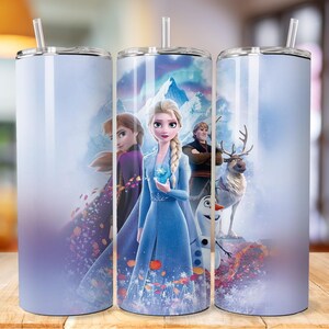 May include: Three stainless steel tumblers featuring a wintery scene with Elsa, Anna, Olaf and Sven from the film Frozen. The background is a light blue gradient with snowflakes and a mountain range.