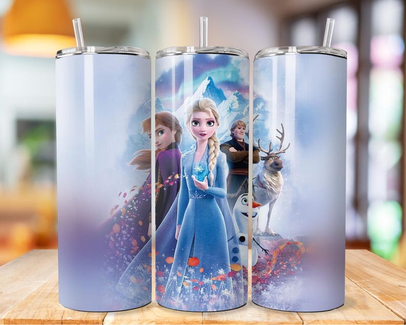 May include: Three stainless steel tumblers featuring a wintery scene with Elsa, Anna, Olaf and Sven from the film Frozen. The background is a light blue gradient with snowflakes and a mountain range.