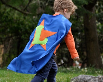 Single-sided capes with Emblem and Initial.
