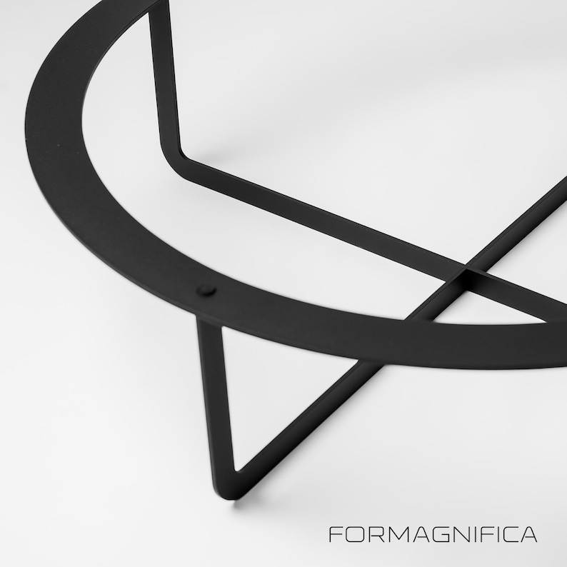 Sculptural X-shape table legs in durable steel