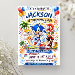May include: A birthday invitation card featuring Sonic the Hedgehog characters including Tails, Knuckles, and Shadow. The text reads: LET'S CELEBRATE! JACKSON IS TURNING TWO! JOIN US FOR A PARTY! SATURDAY, JUNE 19 AT 3:30 PM 123 Mayo St, Richmond, KY 123 RSVP TO MOM: 123-555-1230.
