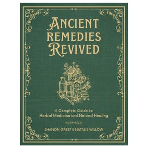 May include: A hardcover book titled "Ancient Remedies Revived" with a green cover and gold decorative border. The book features the text "A Complete Guide to Herbal Medicine and Natural Healing" and the authors' names. An illustration of herbs and bottles is also present.