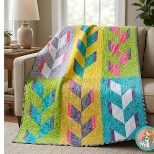 May include: A colorful patchwork quilt with a leaf-like design. The quilt features squares of yellow, green, and teal, with leaf patterns in pink, white, and purple. The quilt is draped over a beige sofa, with a black and white striped border.