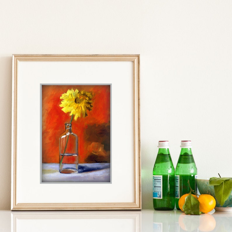 May include: A framed painting of a yellow flower in a clear glass bottle against a red background. Two green glass bottles with red and white caps and some oranges are on the right.