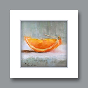 May include: Oil painting of an orange slice, showcasing vibrant orange hues with a hint of yellow. The artwork is set against a soft, muted background, with the artist's signature visible in the lower left corner. The painting is framed in a white mat.