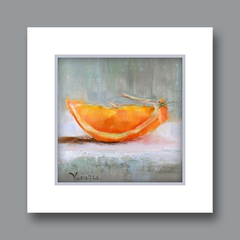 May include: Oil painting of an orange slice, showcasing vibrant orange hues with a hint of yellow. The artwork is set against a soft, muted background, with the artist's signature visible in the lower left corner. The painting is framed in a white mat.