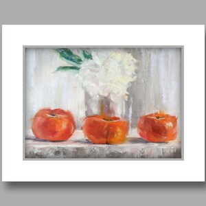 May include: An oil painting depicts three vibrant orange persimmons arranged on a shelf. A clear vase holds a bouquet of white flowers with green leaves, set against a neutral, textured background. The artwork is framed in white.