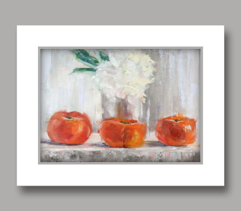 May include: An oil painting depicts three vibrant orange persimmons arranged on a shelf. A clear vase holds a bouquet of white flowers with green leaves, set against a neutral, textured background. The artwork is framed in white.