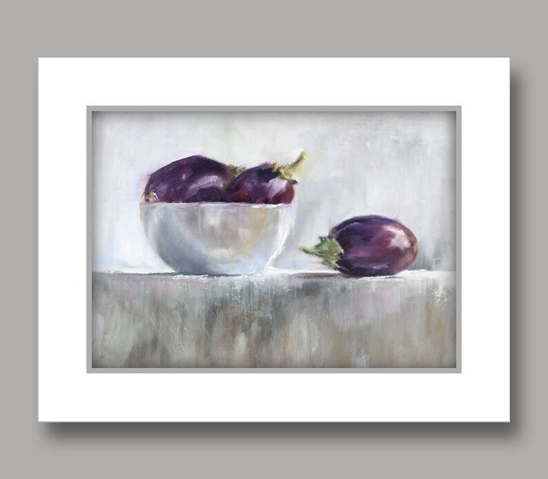 May include: An oil painting depicts a still life of eggplants. Three dark purple eggplants with green stems are in a white bowl, and one eggplant rests beside it. The background is a soft, neutral color, and the painting is framed in white.