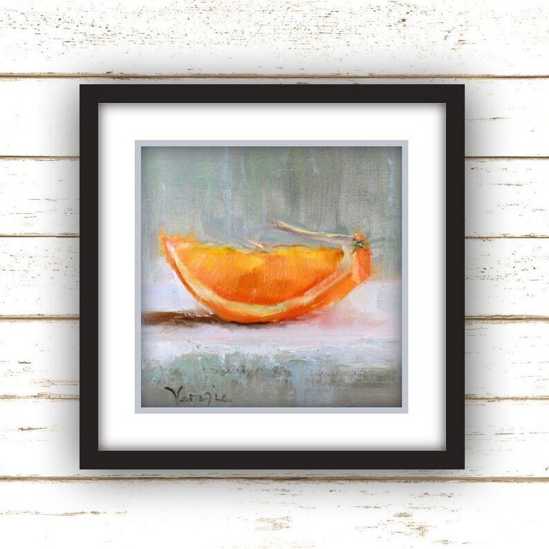 May include: A framed painting of a vibrant orange slice. The artwork features a close-up view of the orange segment, showcasing its bright orange color and textured surface. The painting is set against a soft, muted background, and is framed in a black square frame.